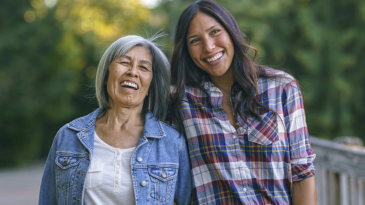 senior citizen mother and daughter smiling